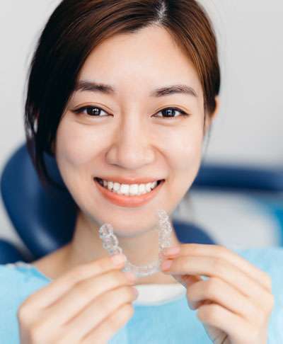 woman with clear aligners